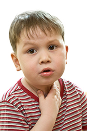 Image of child holding throat